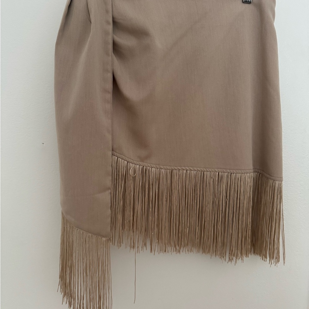 PrettyLittleThing Asymmetrical Fringe Skirt in Beige
